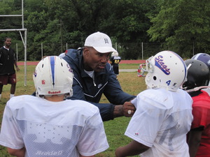 Charles Mann working with players at camp. 